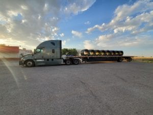 Prime Inc. Flatbed trailer with sunset in background